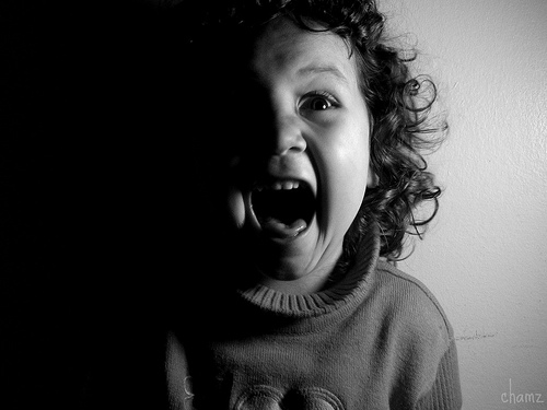 little kid screaming in black and white
